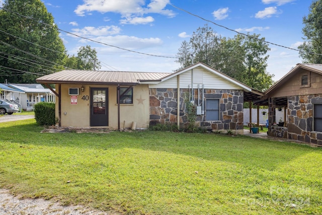 bungalow-style house featuring a front yard