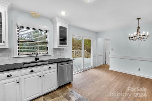 kitchen with dishwasher, sink, tasteful backsplash, white cabinets, and light wood-type flooring