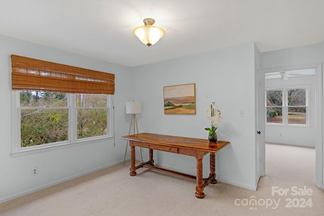 office featuring ceiling fan and light colored carpet