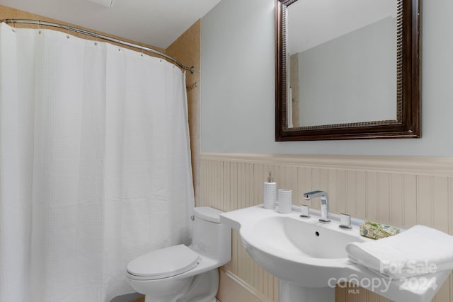 bathroom featuring sink and toilet