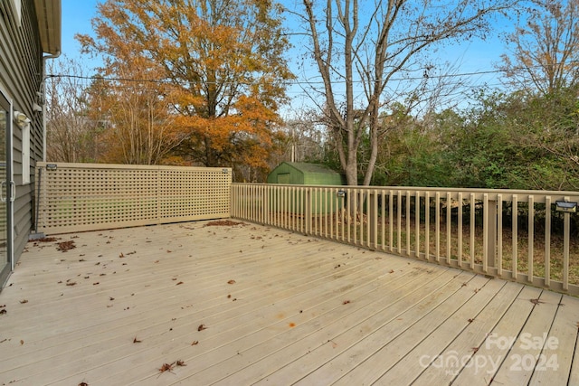 deck with a storage shed