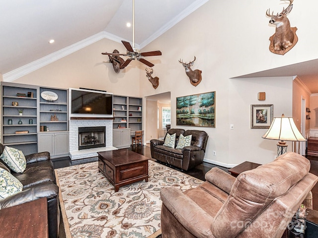 living room with a brick fireplace, vaulted ceiling, ceiling fan, and crown molding