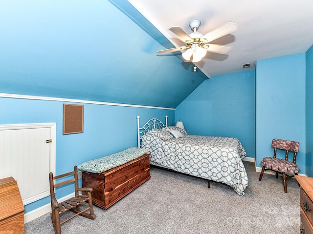 carpeted bedroom featuring vaulted ceiling and ceiling fan