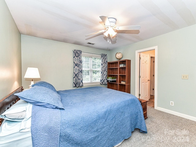 carpeted bedroom with ceiling fan