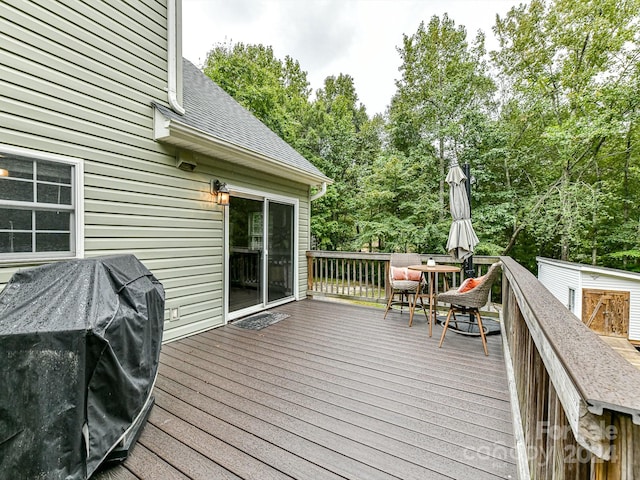 wooden terrace featuring area for grilling