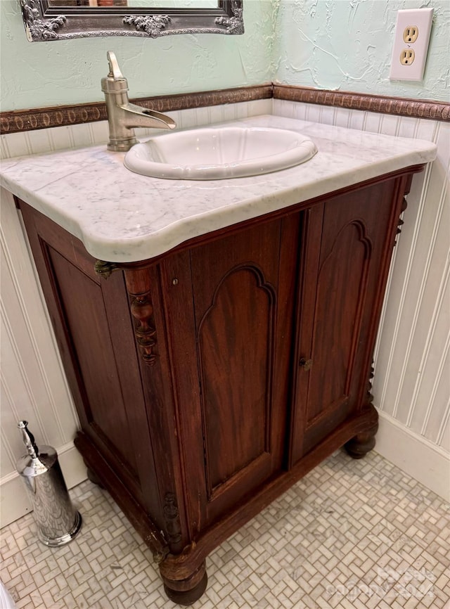 bathroom with tile patterned flooring and sink