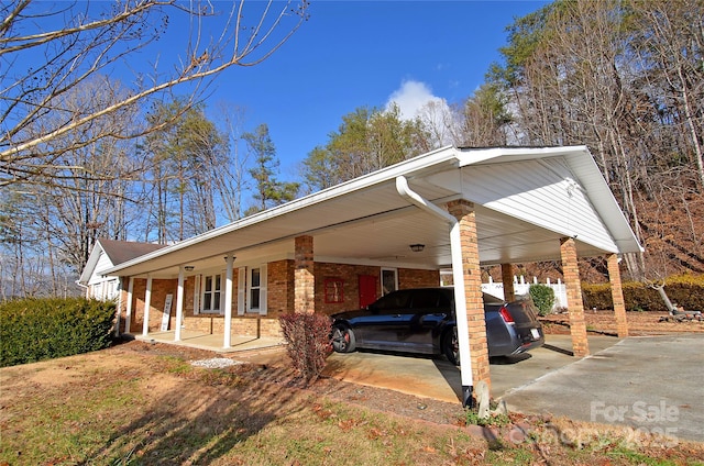 exterior space with a carport and covered porch