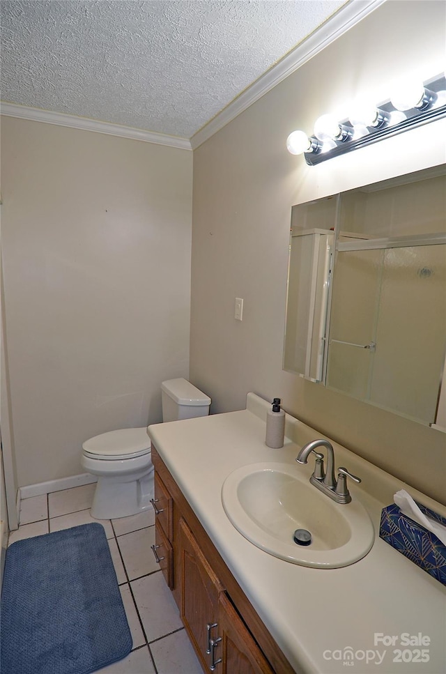 bathroom with vanity, crown molding, tile patterned flooring, a textured ceiling, and a shower with shower door