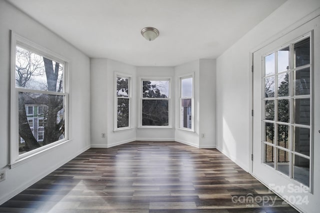 unfurnished sunroom with plenty of natural light