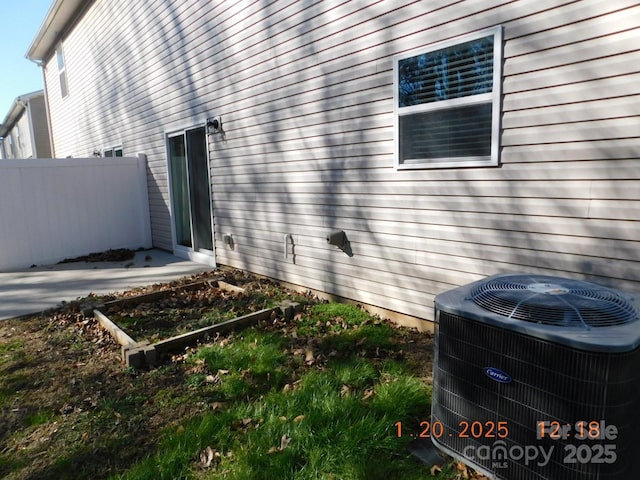 view of side of property featuring central AC unit