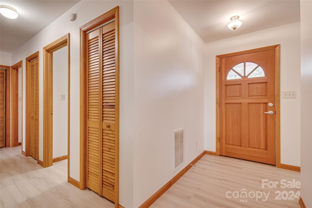 foyer entrance with light wood-type flooring