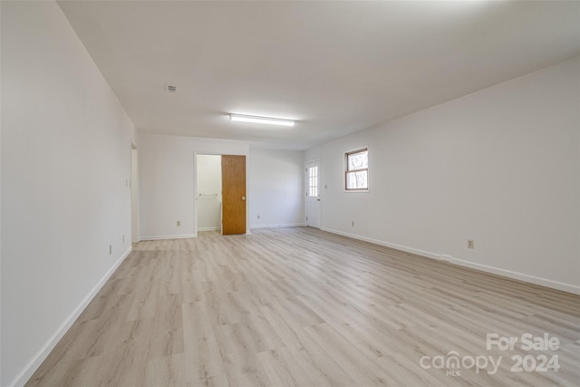 unfurnished room featuring light hardwood / wood-style floors