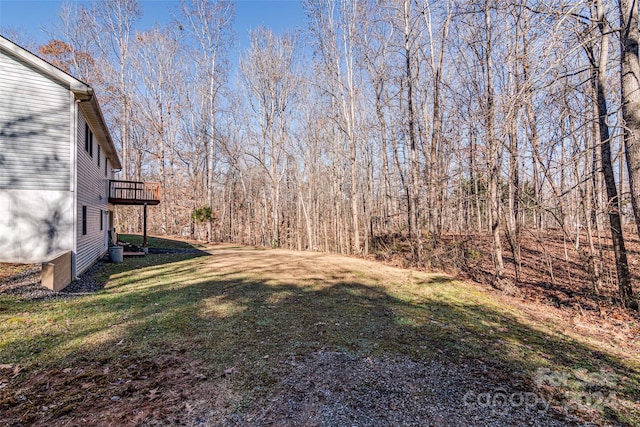 view of yard featuring a wooden deck