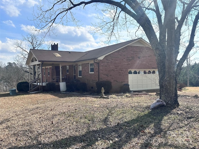 exterior space with a garage and covered porch