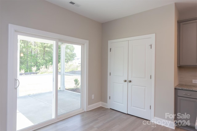 doorway with light hardwood / wood-style flooring