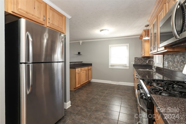 kitchen with backsplash, dark stone counters, dark tile patterned floors, ornamental molding, and stainless steel appliances