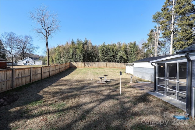 view of yard featuring a sunroom