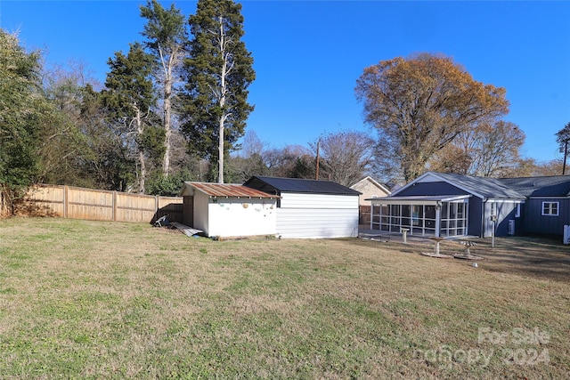 view of yard featuring a sunroom