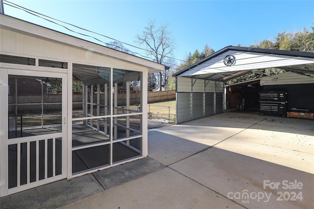 exterior space with a sunroom and a carport