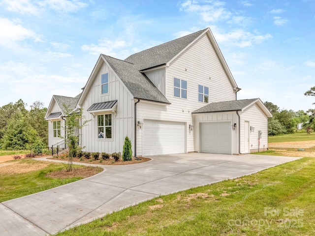 320 Triple Ponds Ct, Clover, SC 29710 - view of front of house with board and batten siding, a shingled roof, a front yard, driveway, and a garage