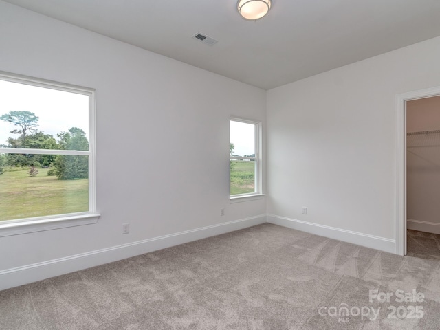 320 Triple Ponds Ct, Clover, SC 29710 - unfurnished bedroom with a spacious closet, light carpet, baseboards, and a closet