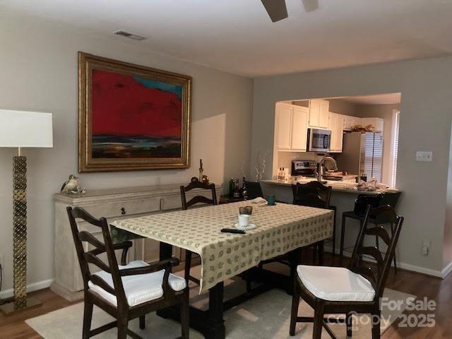 dining space featuring hardwood / wood-style flooring