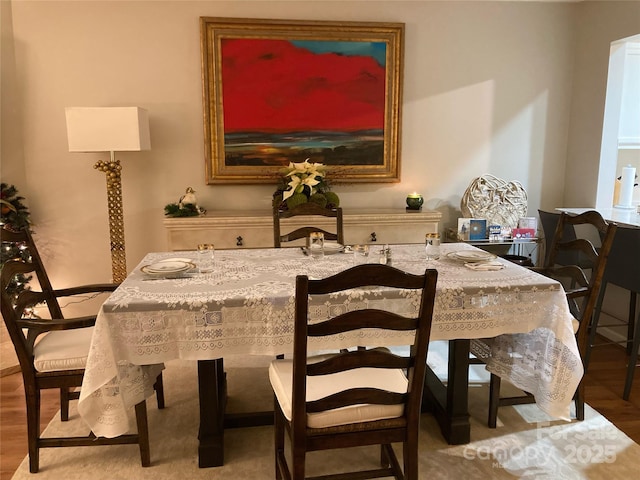 dining room with hardwood / wood-style flooring