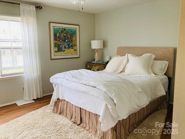 bedroom with wood-type flooring