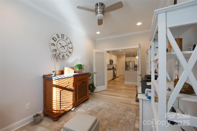 hall featuring french doors, light wood-type flooring, and ornamental molding