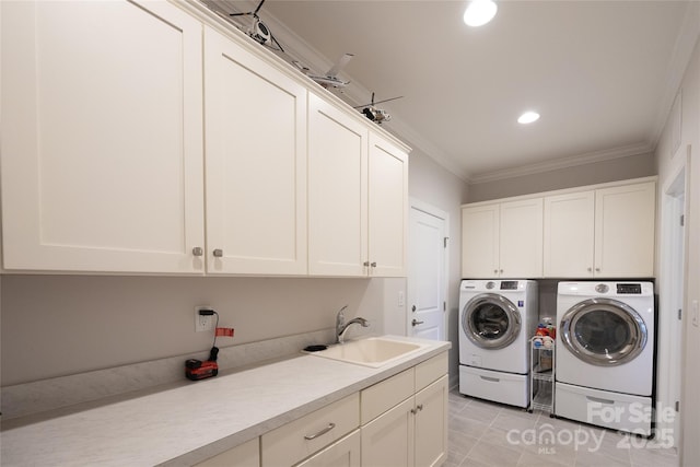 washroom with cabinets, crown molding, sink, separate washer and dryer, and light tile patterned flooring