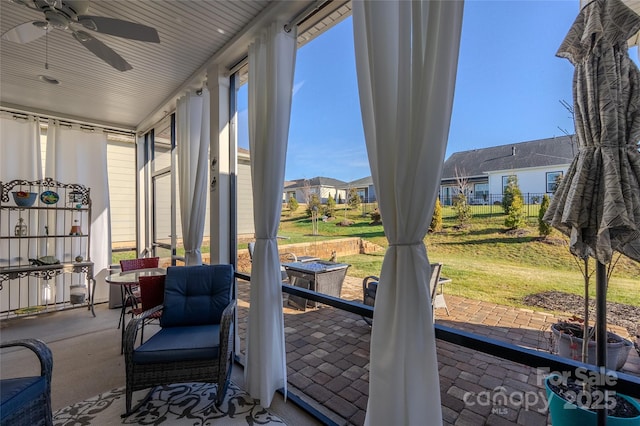 sunroom / solarium with ceiling fan