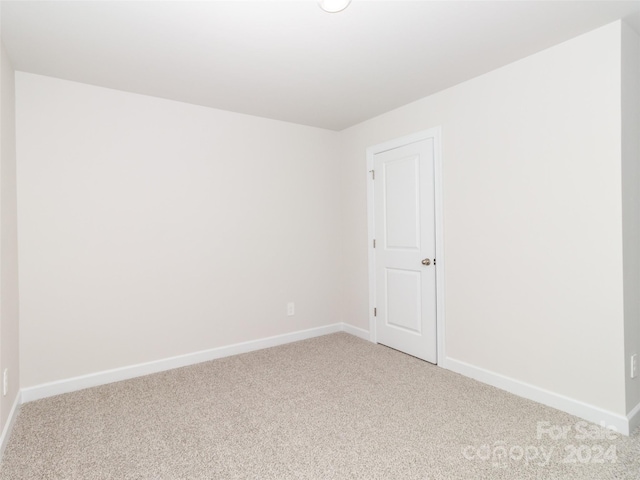 spare room featuring carpet flooring