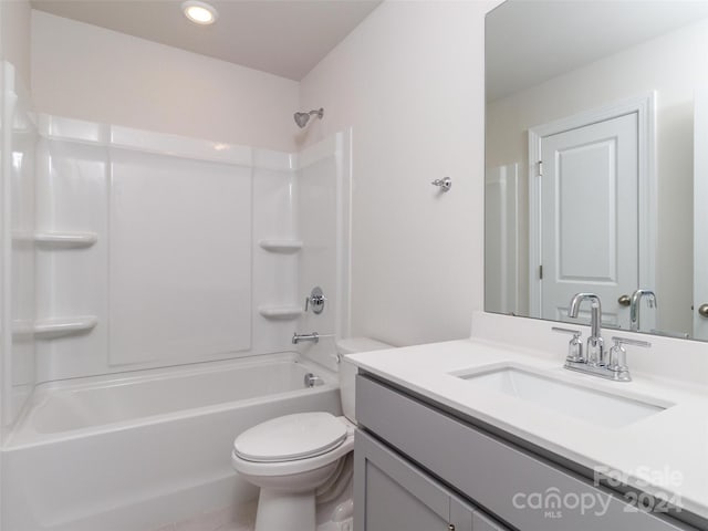 full bathroom with vanity, toilet, and shower / washtub combination