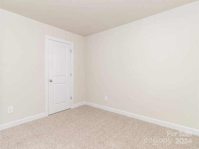 empty room with carpet flooring