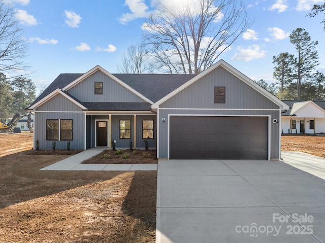 view of front of home with covered porch and a garage