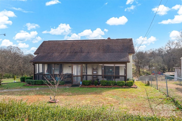 view of front of house with covered porch and a front yard