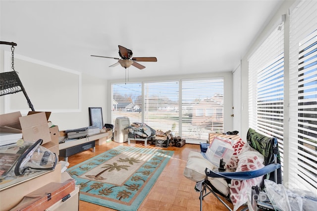 interior space featuring plenty of natural light, ceiling fan, and light parquet flooring