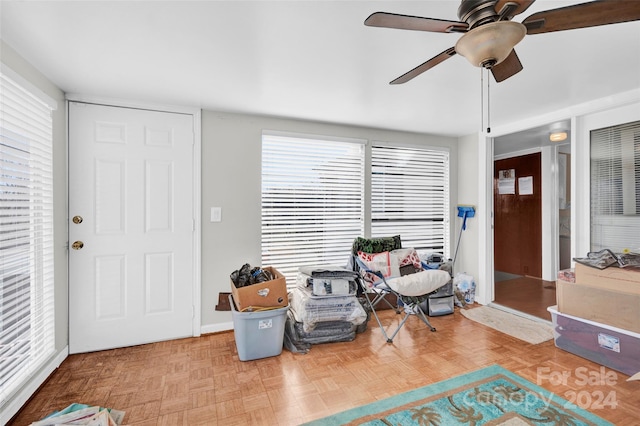 entryway with ceiling fan and parquet floors