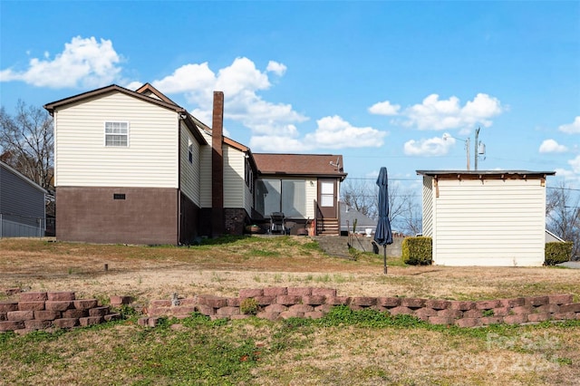 view of home's exterior with a yard