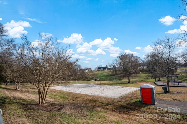 exterior space with a yard and volleyball court