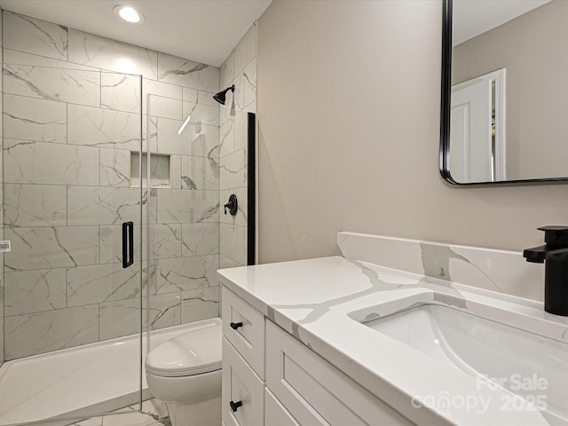 full bathroom featuring toilet, recessed lighting, vanity, marble finish floor, and a shower stall