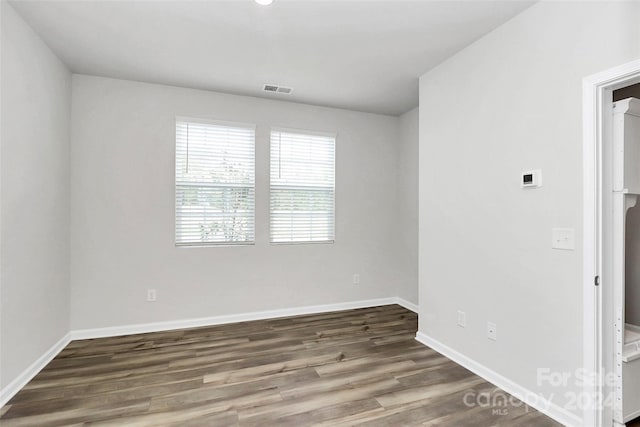 empty room featuring dark hardwood / wood-style floors