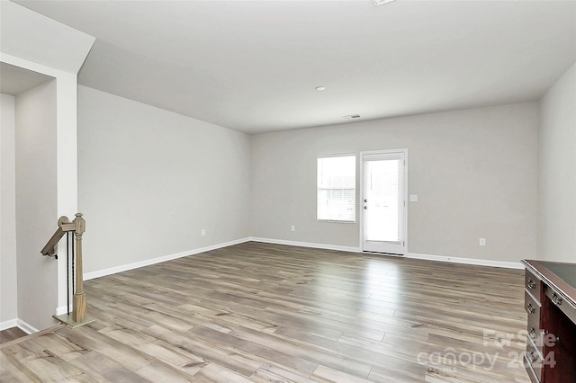 unfurnished room with light hardwood / wood-style floors