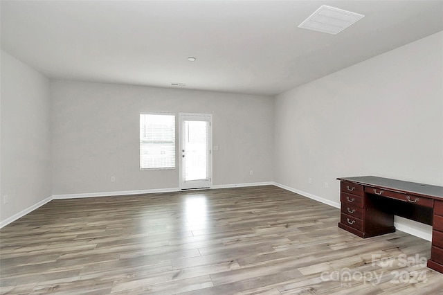 spare room featuring light hardwood / wood-style floors