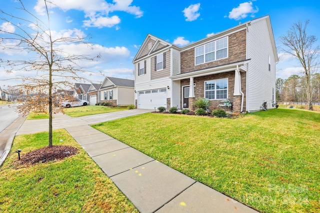 view of front of home with a garage and a front yard