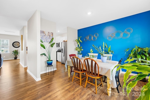 dining space featuring hardwood / wood-style floors