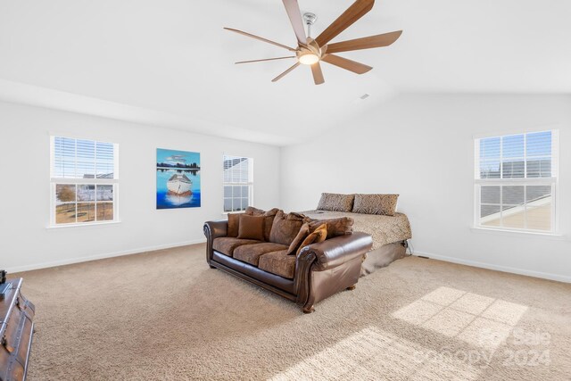 carpeted living room with vaulted ceiling and ceiling fan