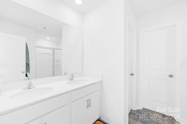 bathroom featuring vanity and walk in shower