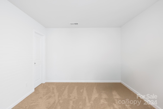 unfurnished room with carpet flooring