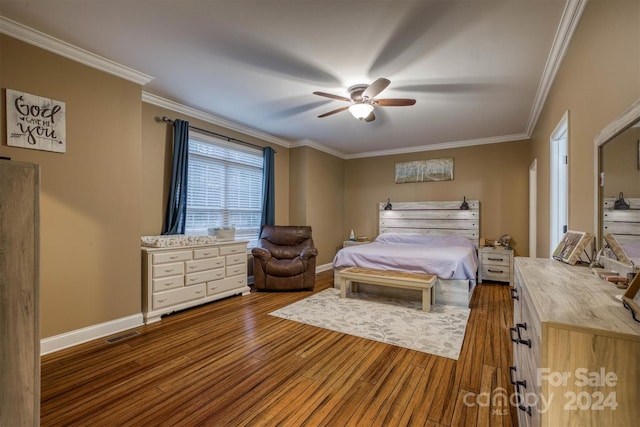 bedroom featuring dark hardwood / wood-style floors, ceiling fan, and ornamental molding